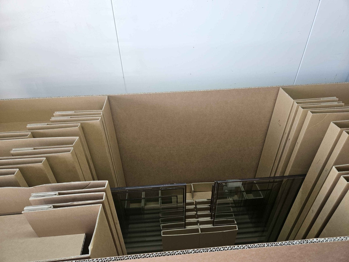 Glavenir vacuum glass factory seconds packed upright in cardboard divider crates