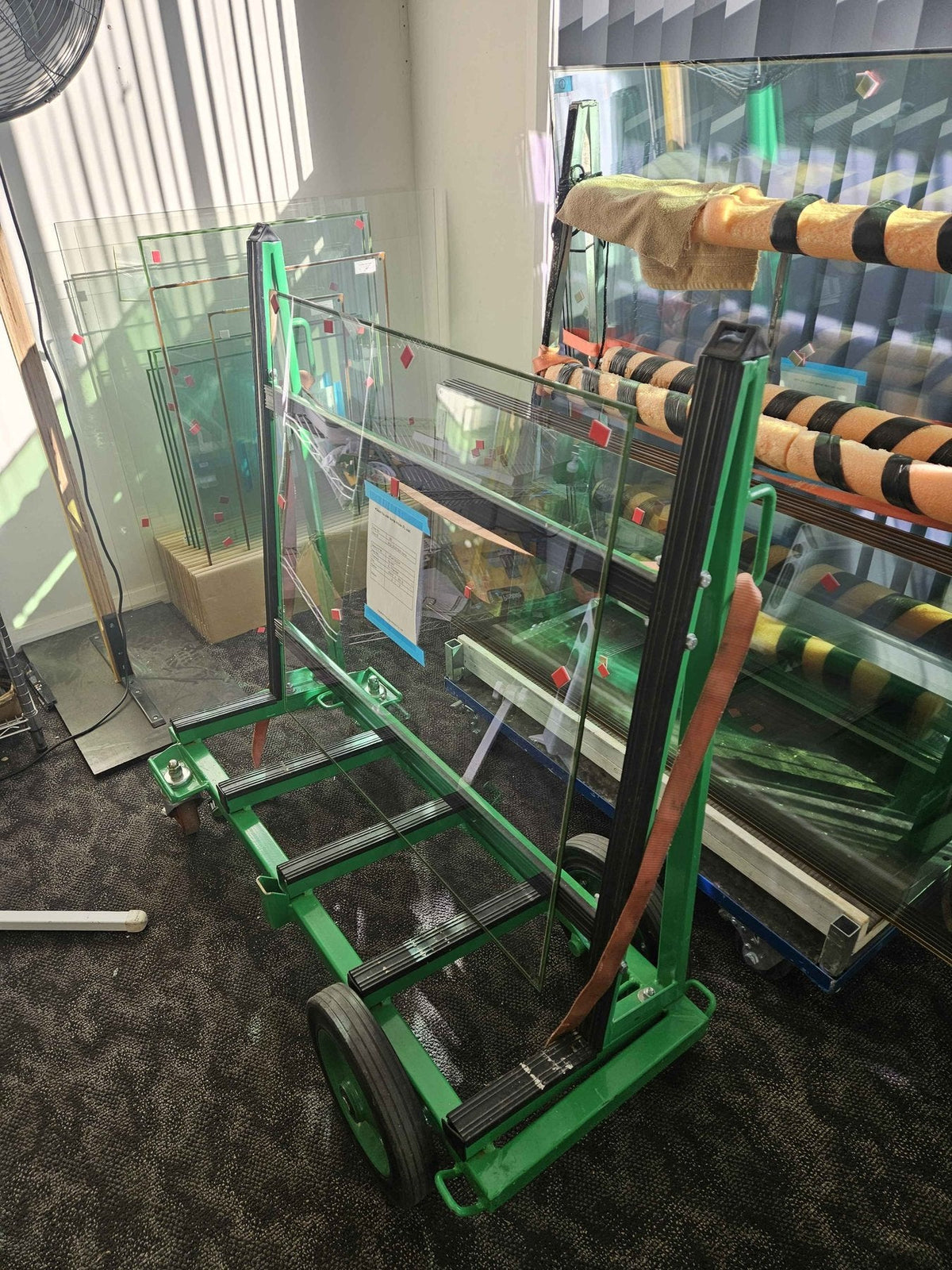 Glavenir vacuum glass panes on a glass trolley with edge protection markers